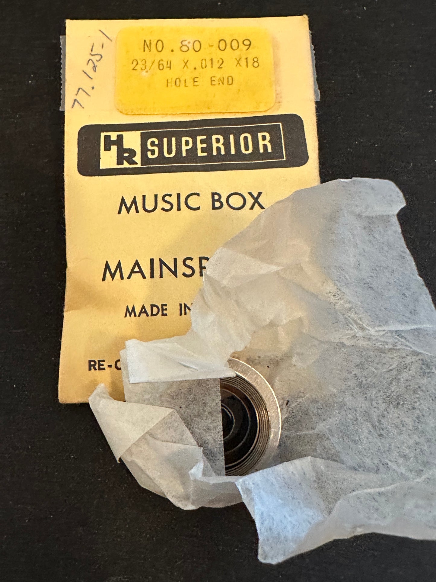 HR Superior Hole End Music Box Mainspring - 23/64" x .012 x 18" Long - No. 80-009