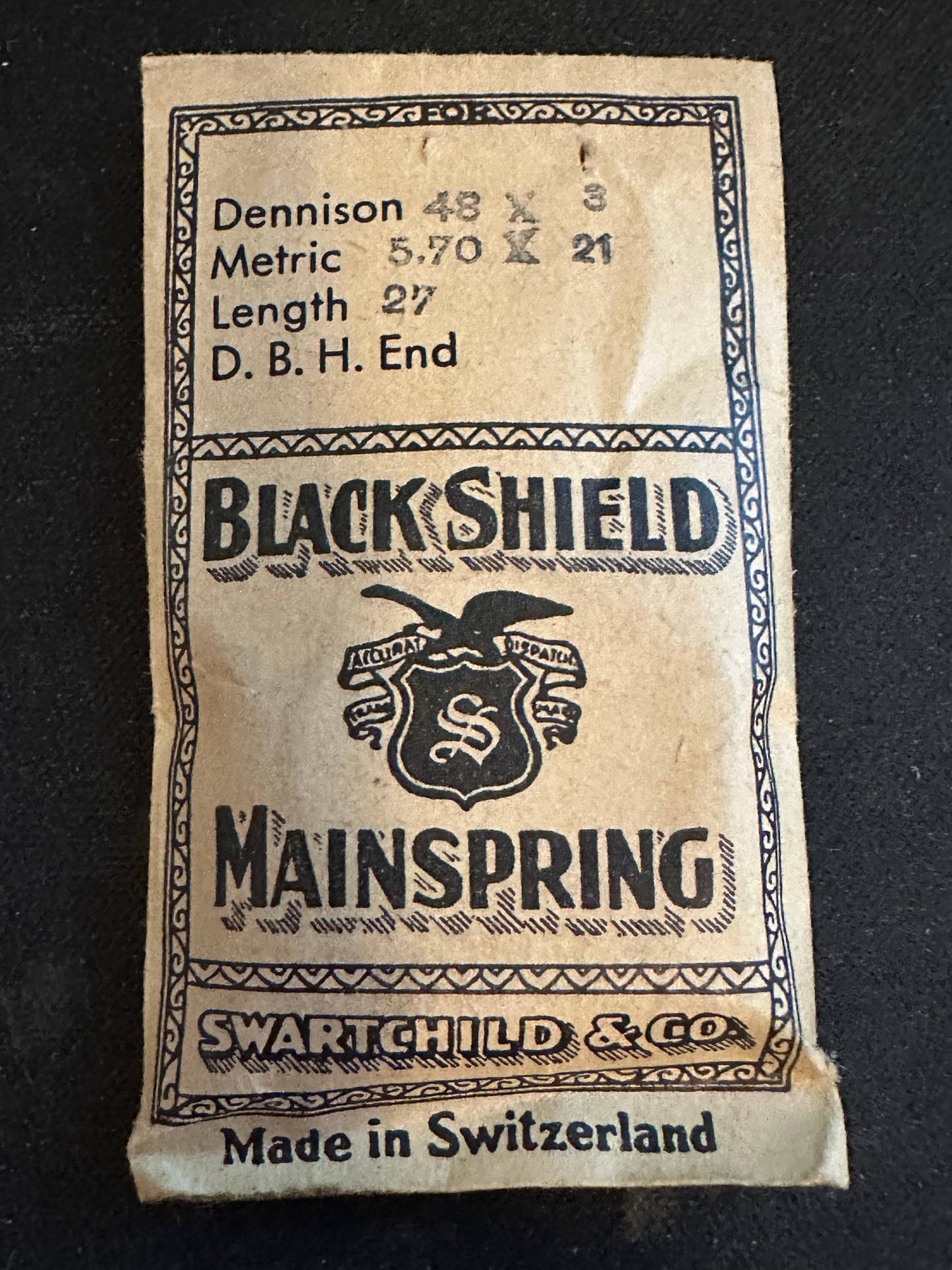 Swartchild Black Shield Clock Mainspring 5.6 x .21 mm x 27" DB&H end - Steel